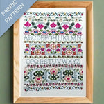 Framed fabric pattern with floral and geometric design on a green background