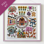 Embroidery kit with a garden scene including flowers, trees, and animals on a white background.