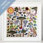 Framed fabric pattern with animals, trees, and plants on a white background