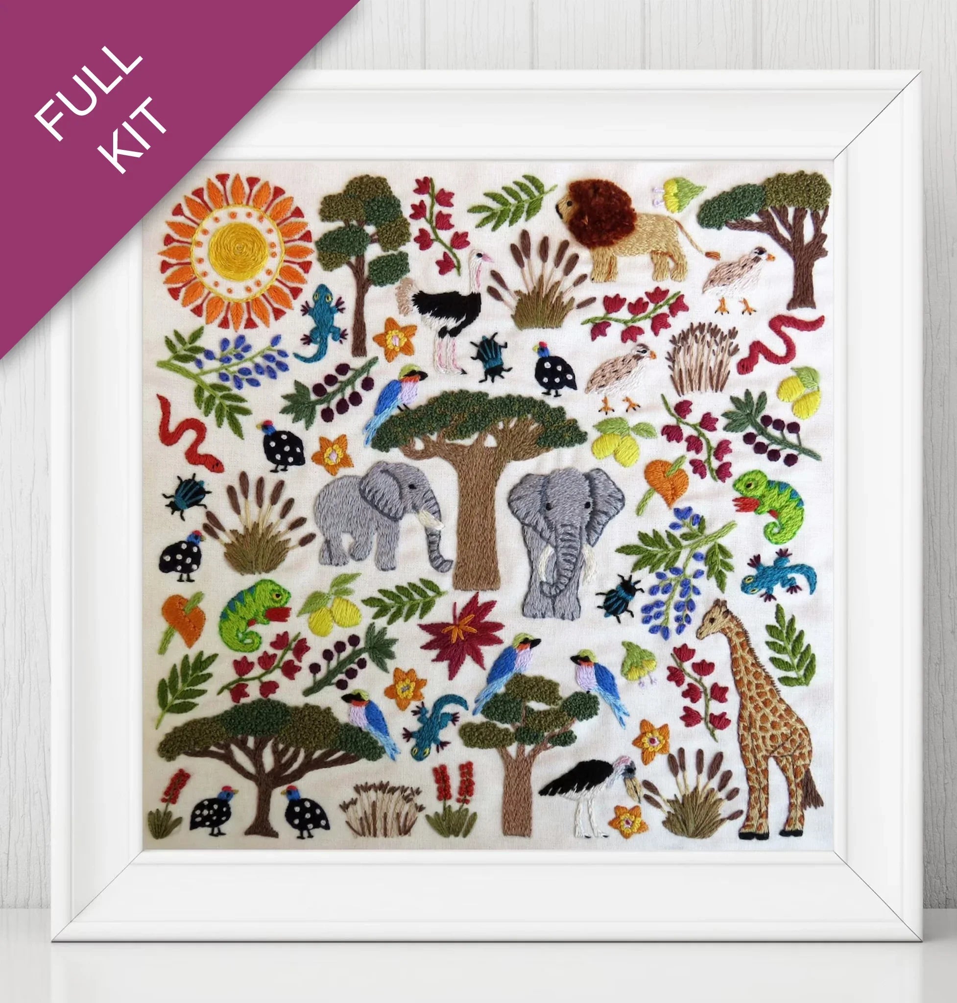 Embroidery kit with colorful animals and plants on a white background