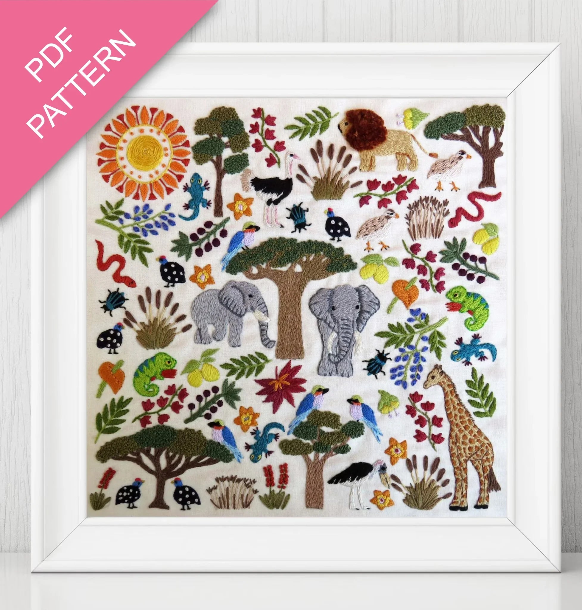 Colorful animal pattern with trees and plants on a white background, framed with a pink border.