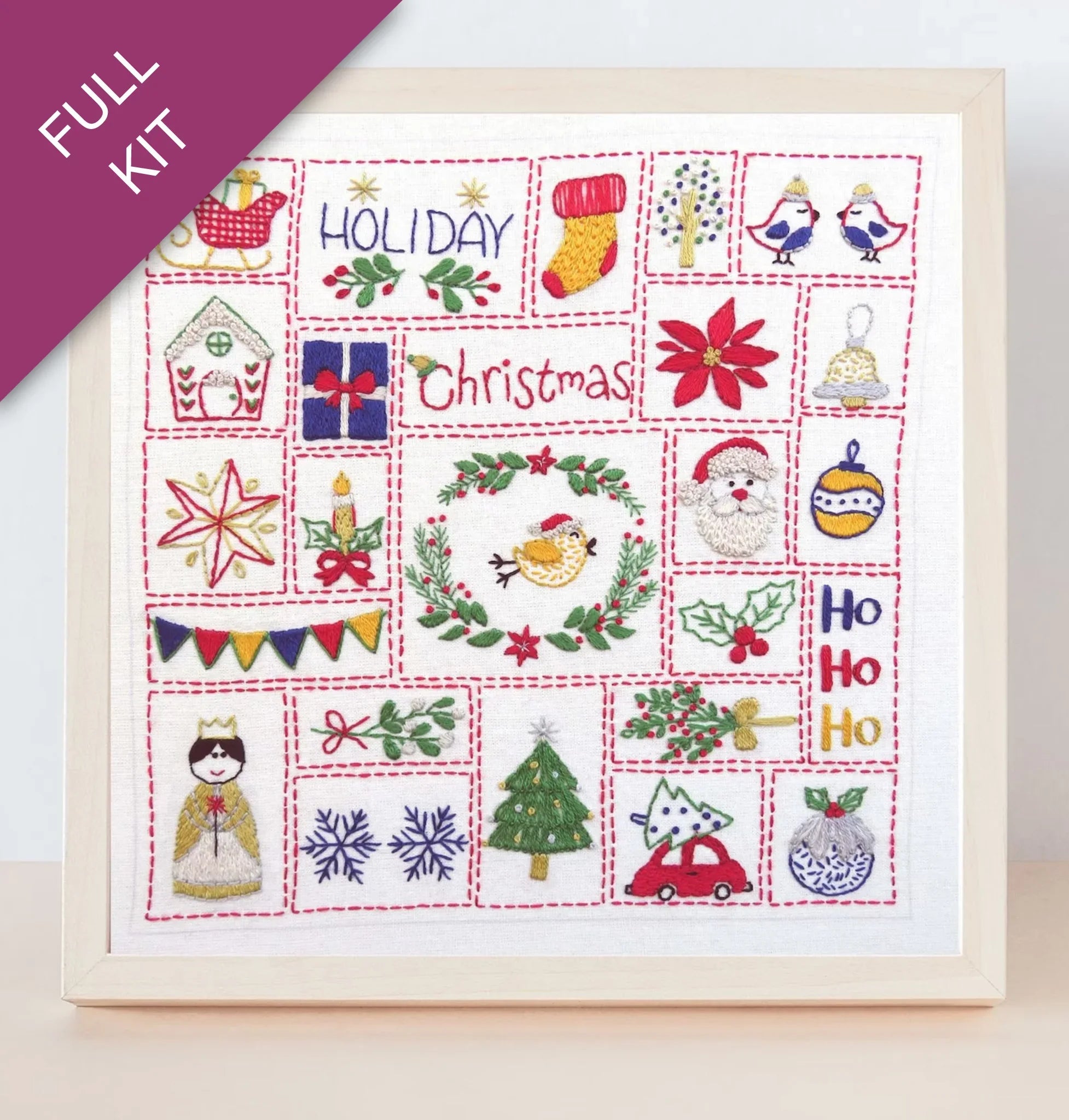 Embroidery kit with Christmas-themed designs on a white background