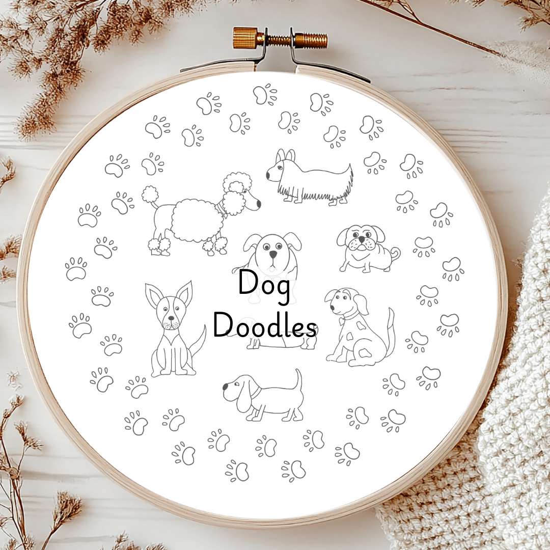 Embroidery hoop with 'Dog Doodles' design on a white background