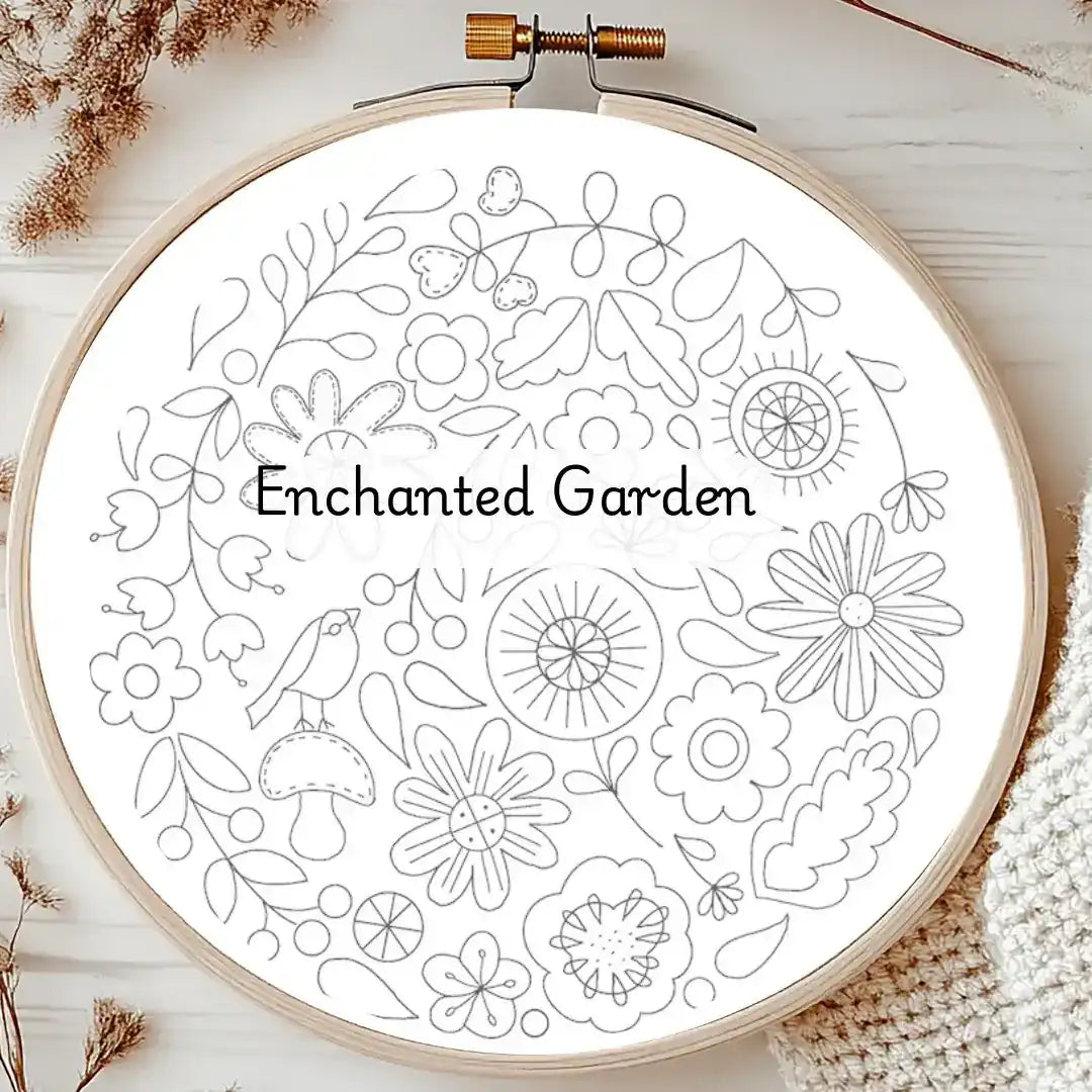Embroidery hoop with 'Enchanted Garden' floral design on a white background