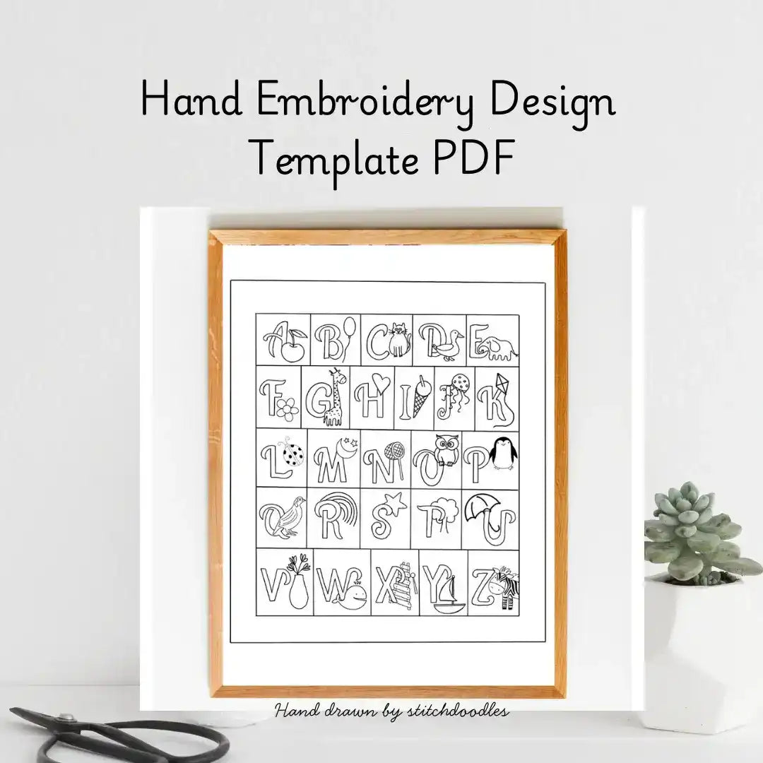 Hand embroidery design template PDF with alphabet and symbols in a wooden frame on a white background.