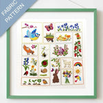 Framed fabric pattern with embroidered designs of animals, plants, and nature-themed elements.