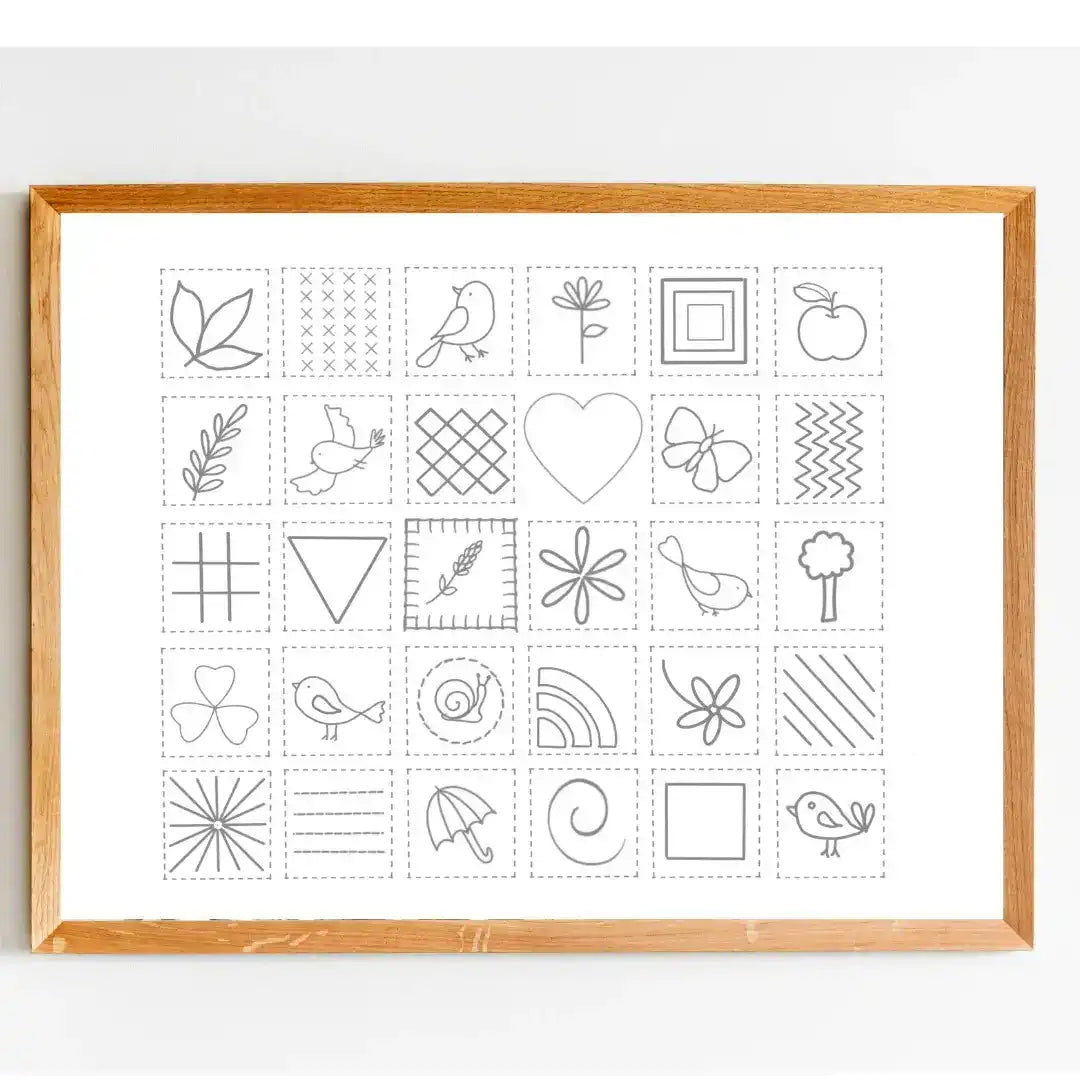Framed print with black line art designs on a white background