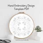 Hand embroidery design template PDF with a wooden hoop on a white background