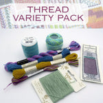 Thread variety pack with colorful threads and packaging on a white background