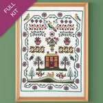 Embroidery kit with a house and nature design on a green background