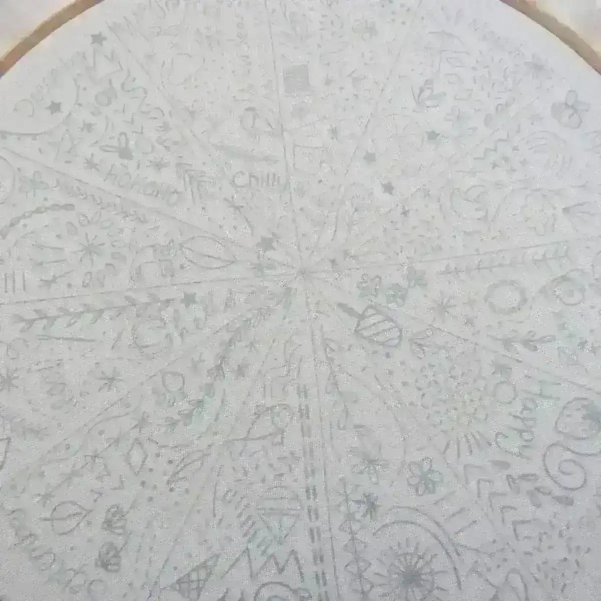 Circular design with various patterns and symbols on a white background