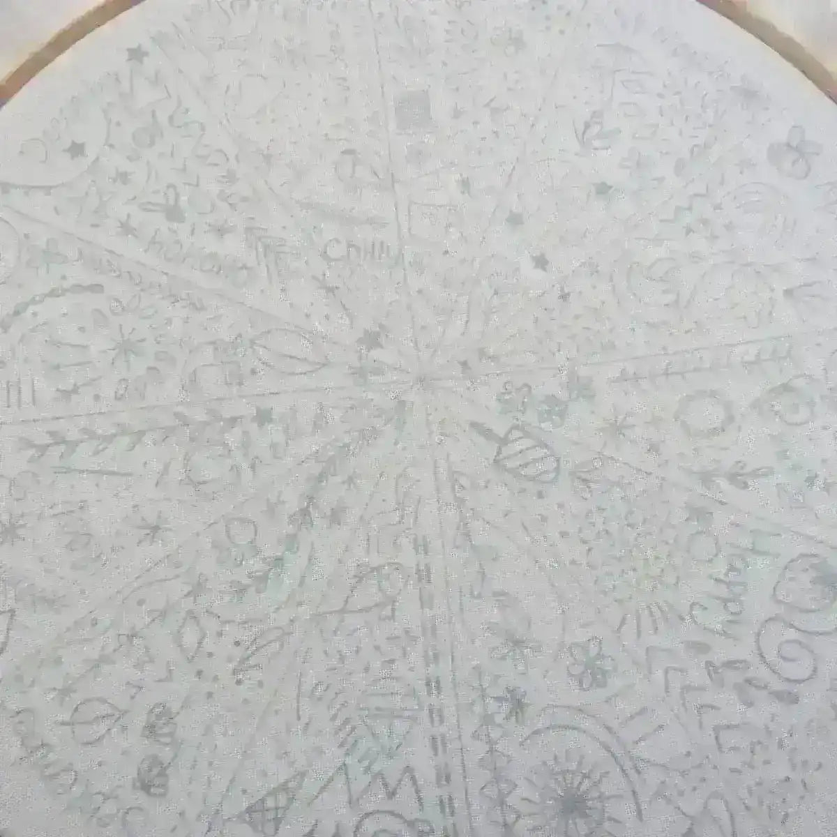 Circular design with various patterns and symbols on a white background