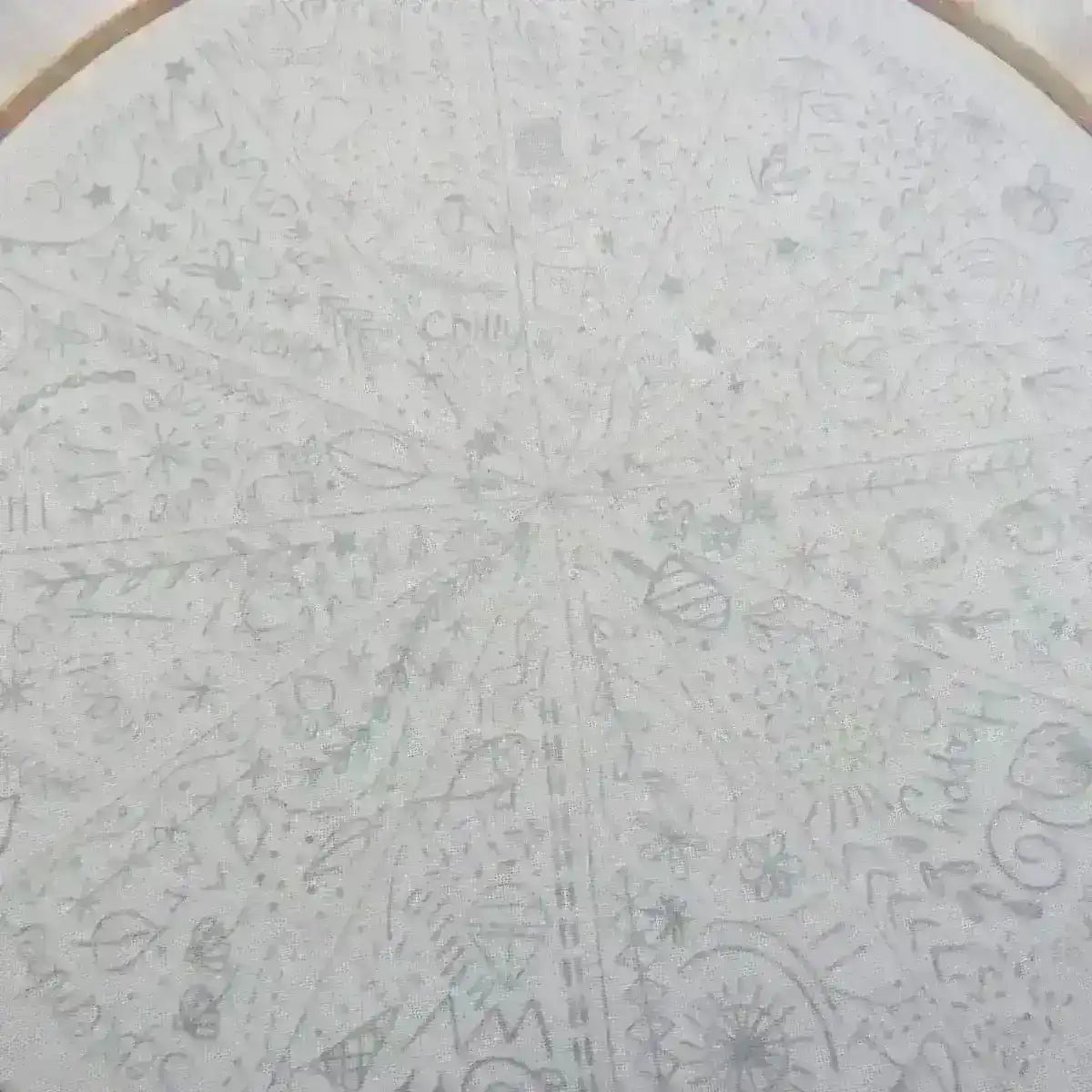 Circular design with various patterns and symbols on a white background