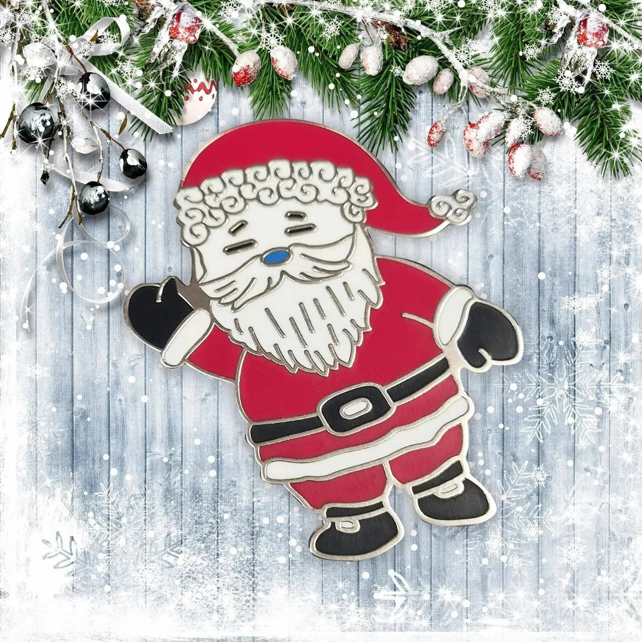 Cartoon Santa Claus ornament on a wooden background with Christmas decorations.