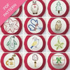 Collection of embroidered designs on red borders with a PDF pattern label.