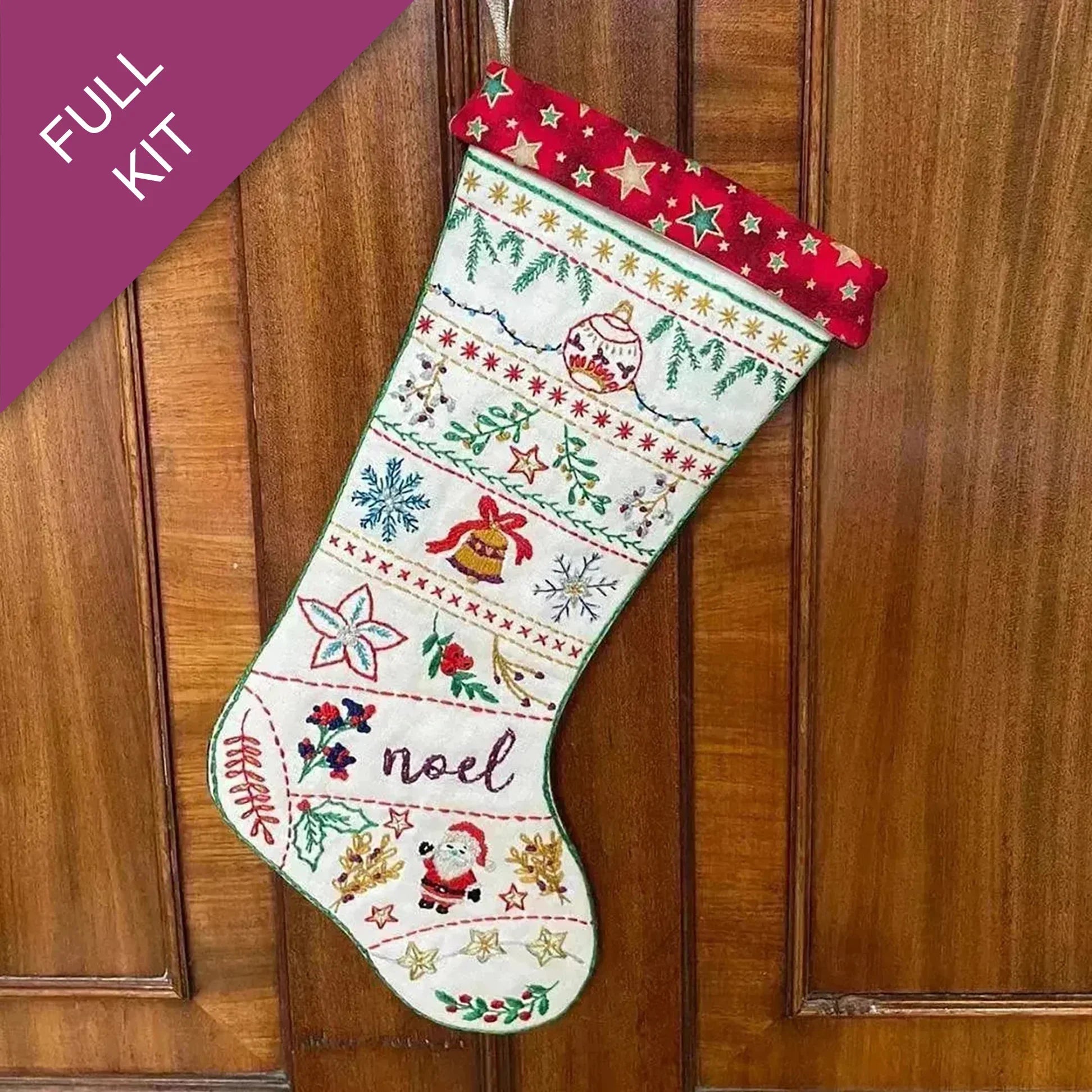 Embroidered Christmas stocking with festive patterns on a wooden door