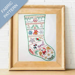 Framed fabric pattern of a Christmas stocking with embroidery design.