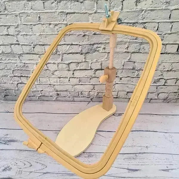 Wooden embroidery hoop on a gray background