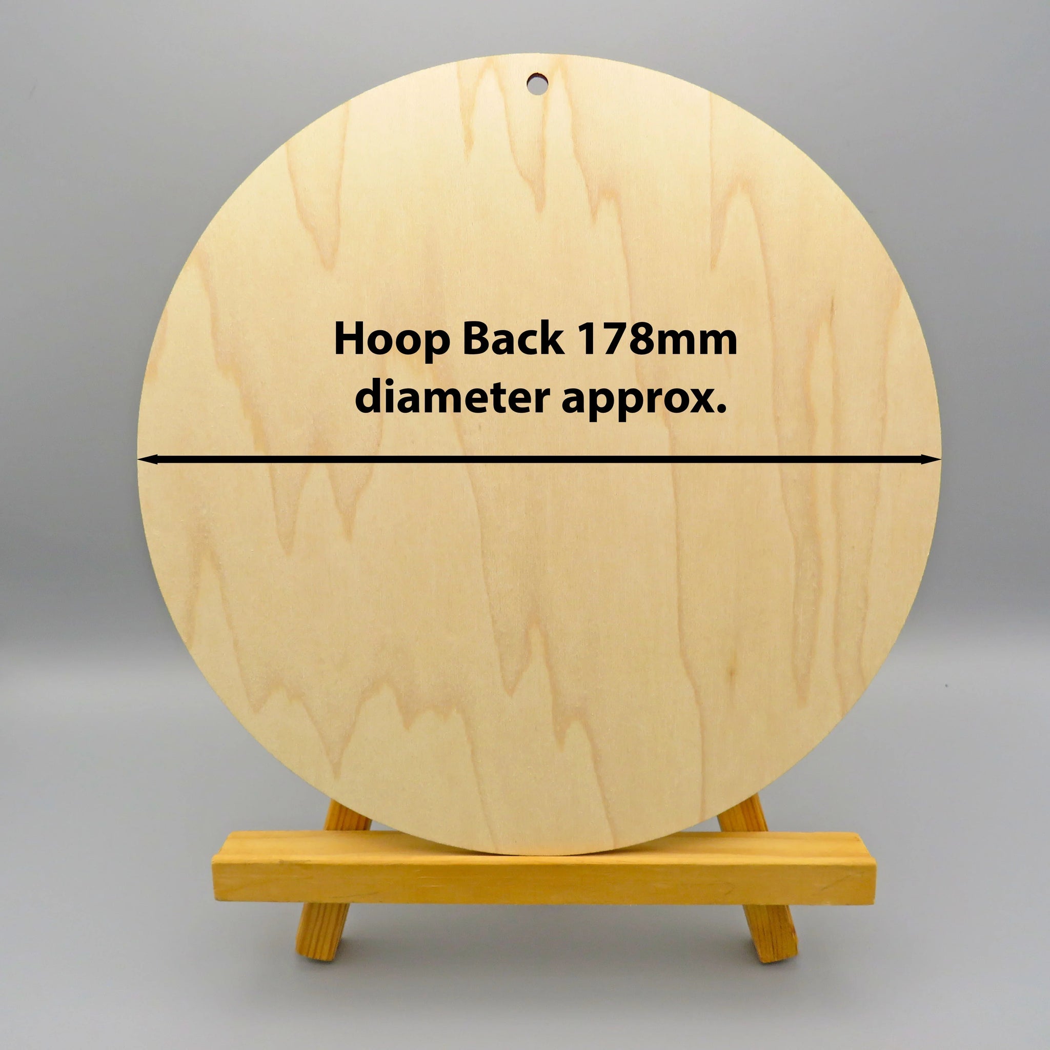 Wooden hoop with text on a gray background