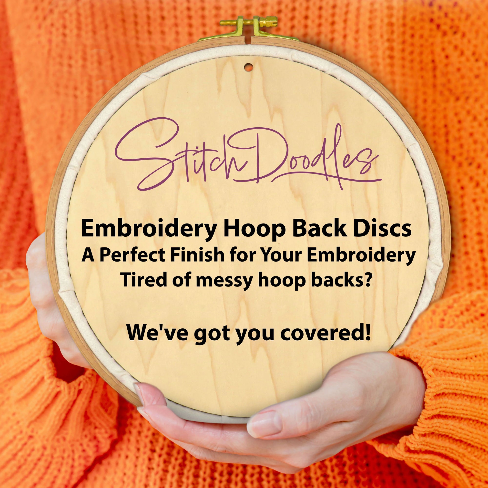 Embroidery hoop with 'Stitch Doodles' branding and text about embroidery hoop back discs.