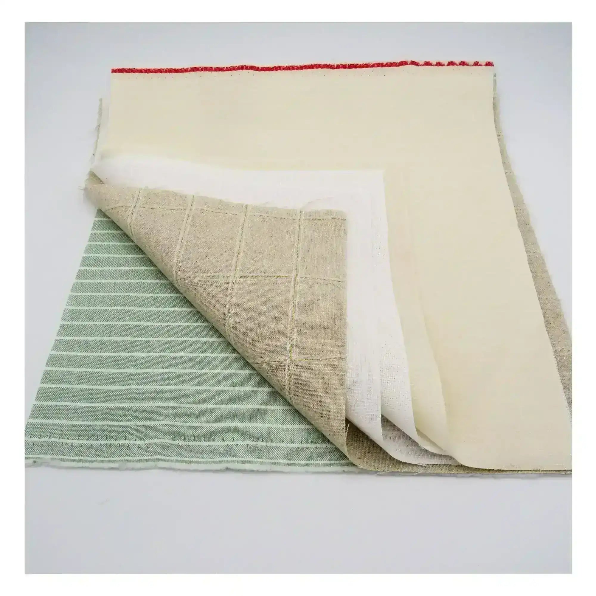 Collection of fabric swatches in beige, green, and red on a white background