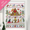 Christmas-themed cross-stitch pattern with a cabin, animals, and festive elements on a white background.