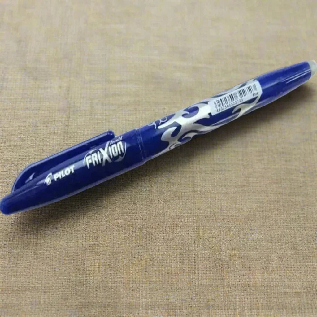 Pilot Frixion pen on a beige fabric background