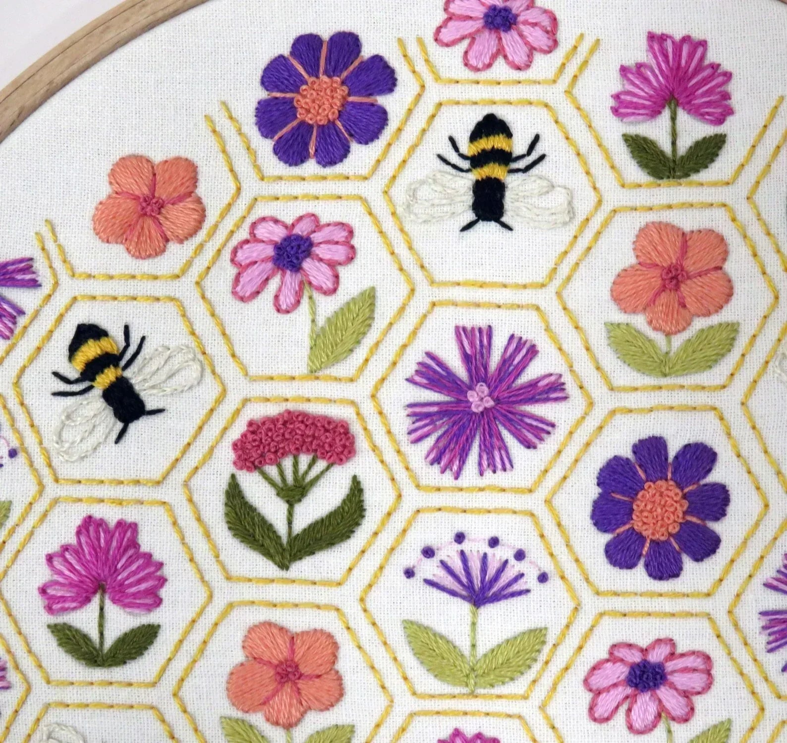 Embroidery hoop with floral and bee pattern