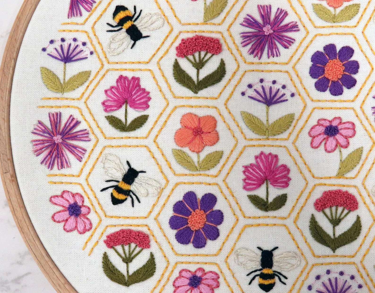 Embroidery hoop with floral and bee pattern