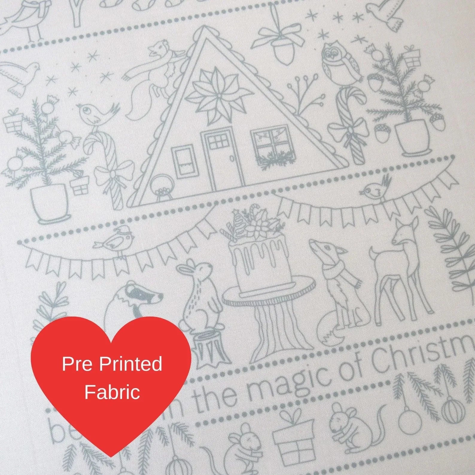 Pre-printed fabric with Christmas-themed design and a red heart label.