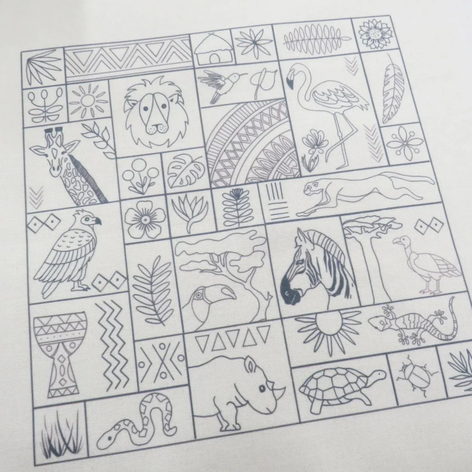 Sheet of black and white animal and nature illustrations on a grid.