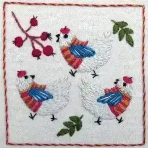 Embroidered design of three chickens wearing scarves with berries and leaves on a white background.