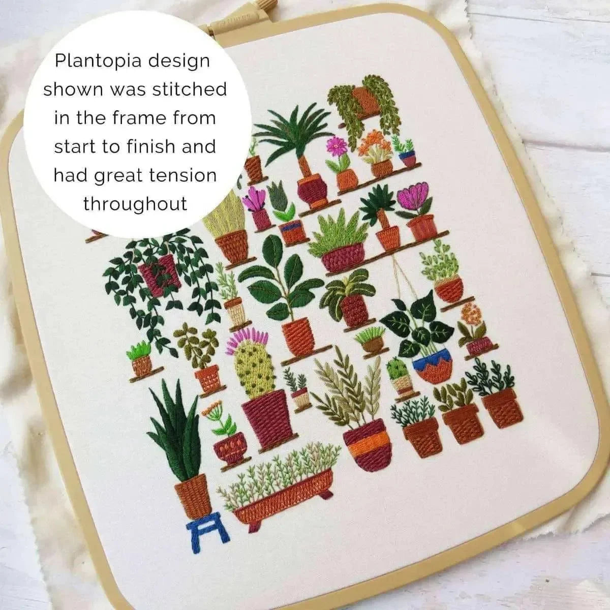 Embroidery of a plant-themed design on a white background