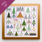 Embroidery kit with various Christmas tree designs on a white background