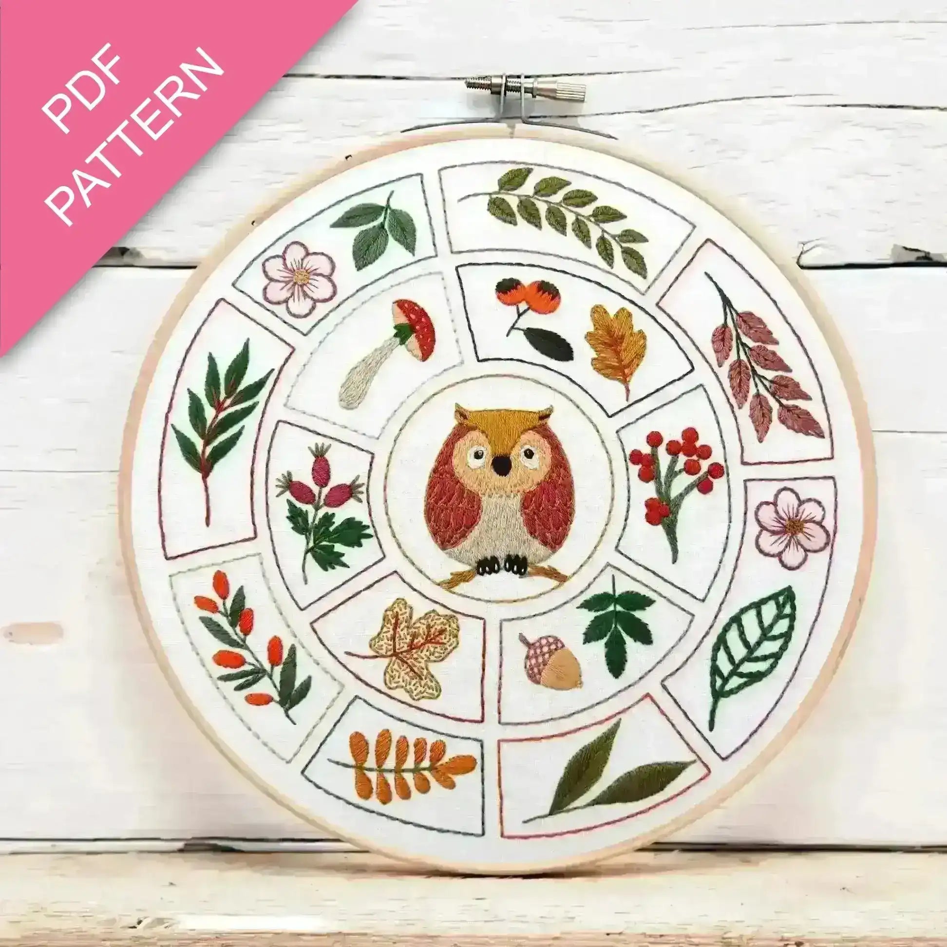 Embroidery hoop with owl design and floral patterns on a wooden surface, featuring 'PDF Pattern' text.