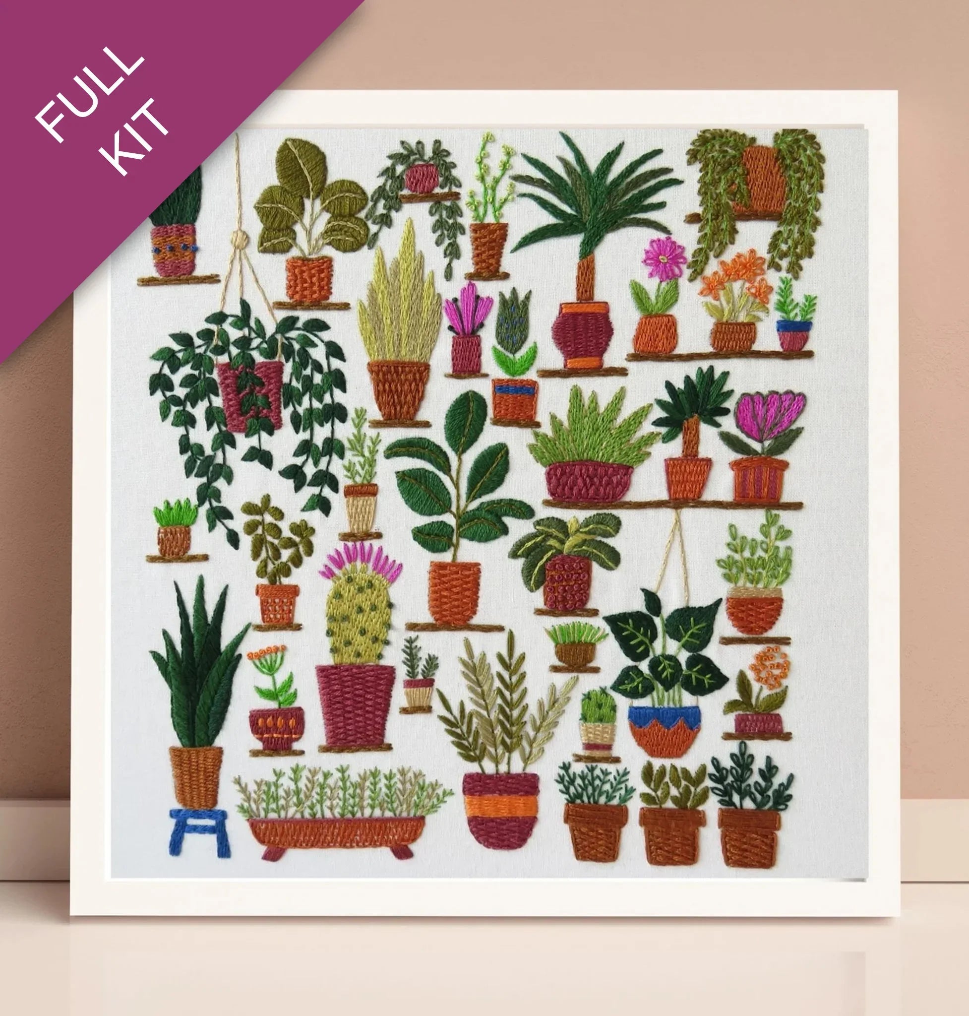 Embroidery kit with a design of various potted plants on a white background.