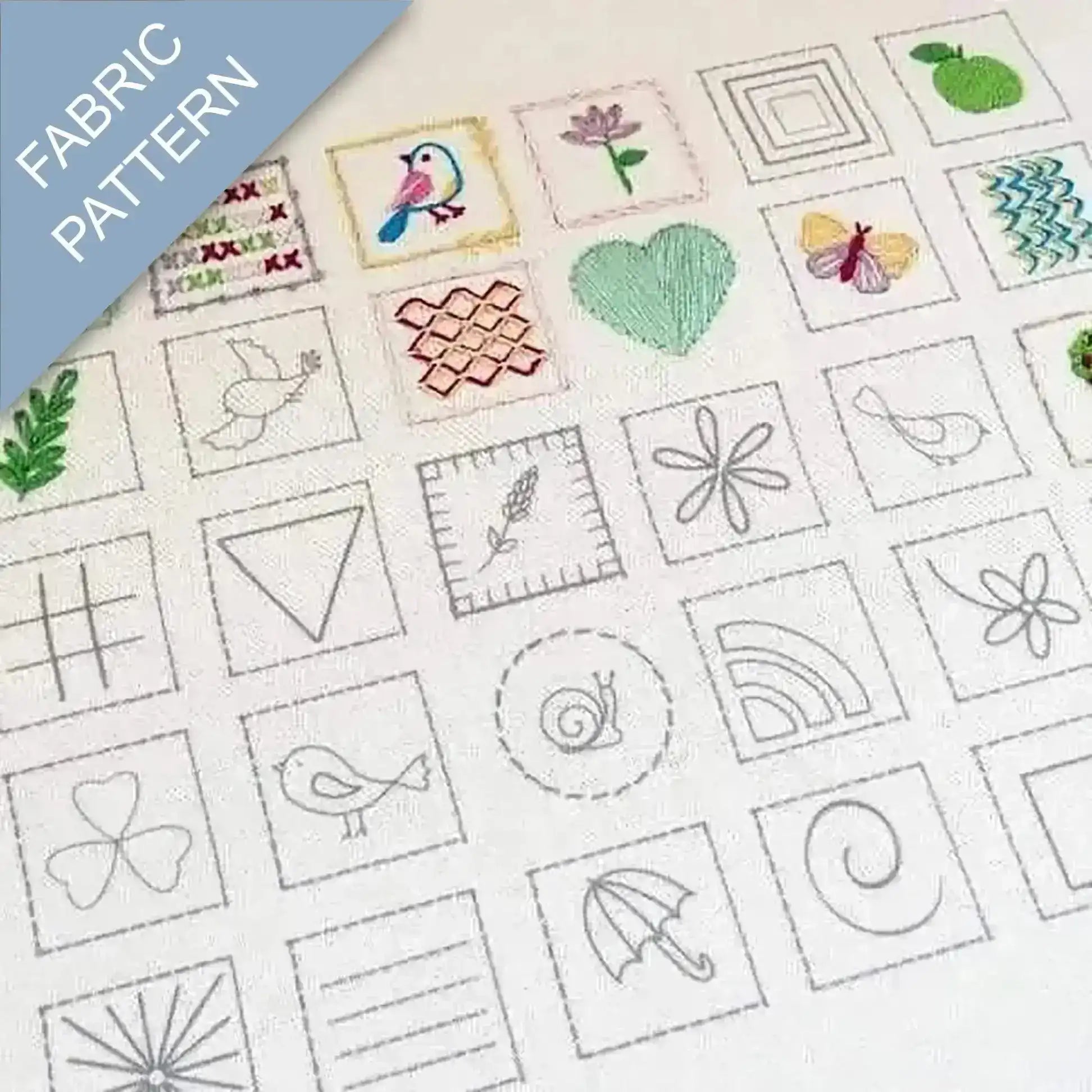 Collection of embroidered patterns on fabric with various designs including birds, flowers, and geometric shapes.