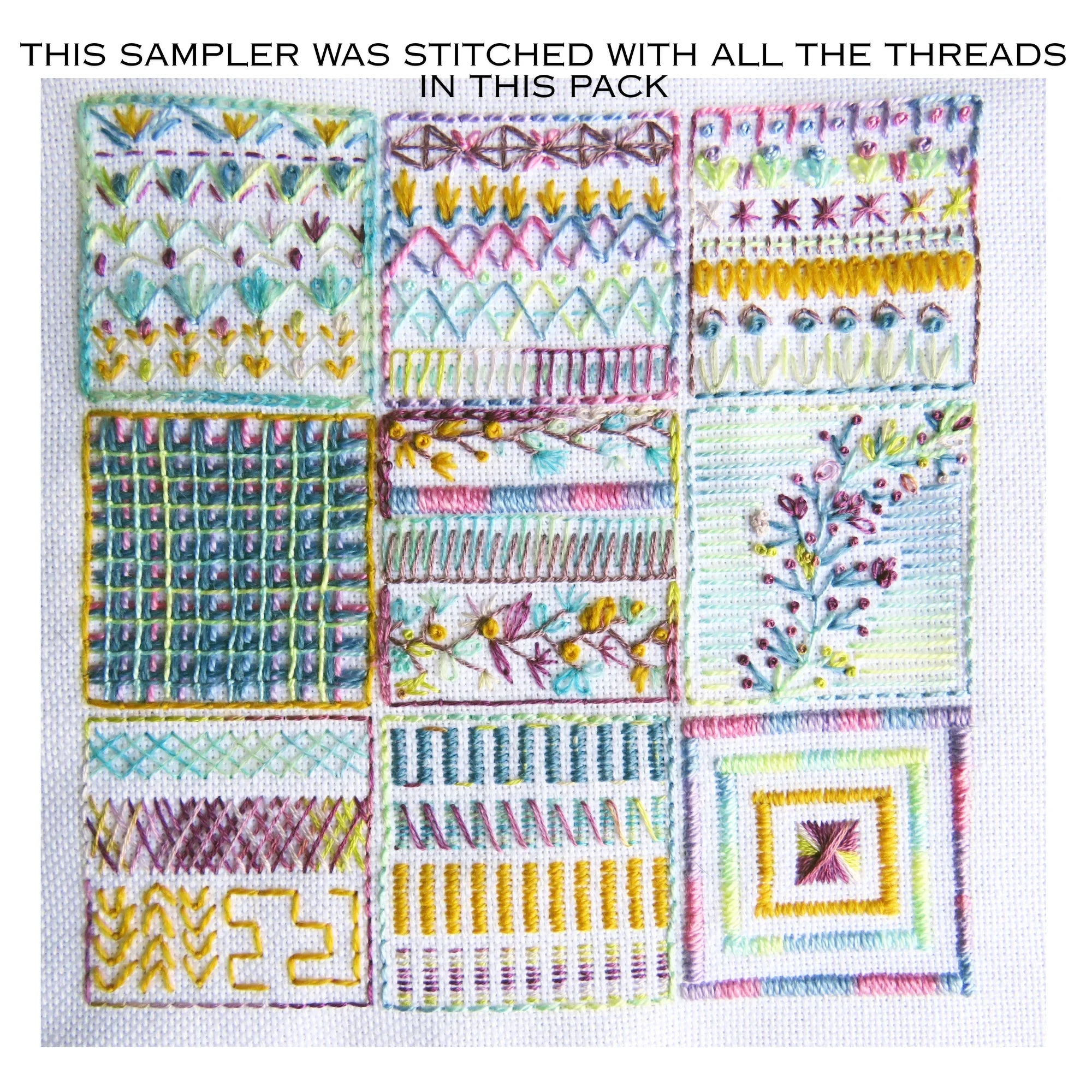 Embroidery sampler with various stitches and patterns on a white background