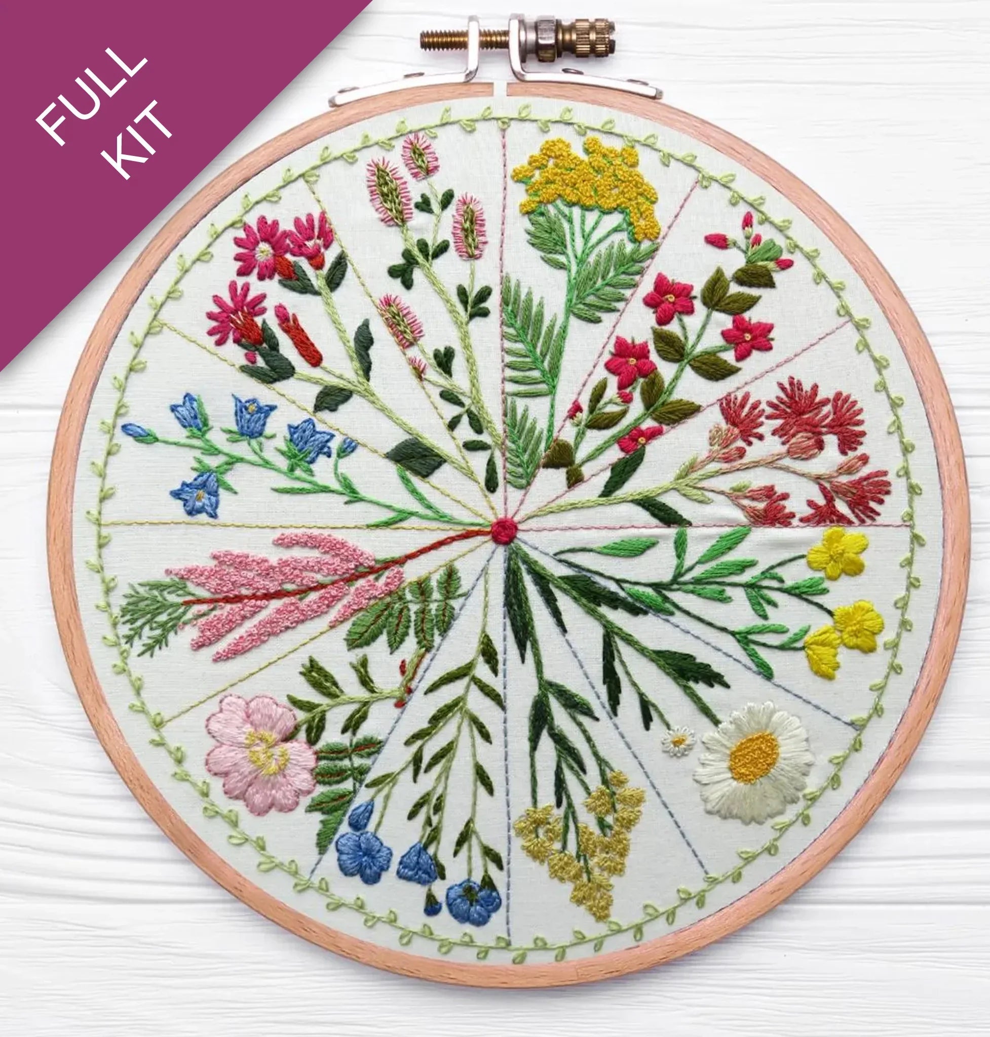 Embroidery hoop with floral design on a white background