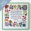 Fabric pattern with colorful flowers and a quote by William Morris on a white background