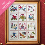 Framed cross-stitched sampler with various designs on a red background