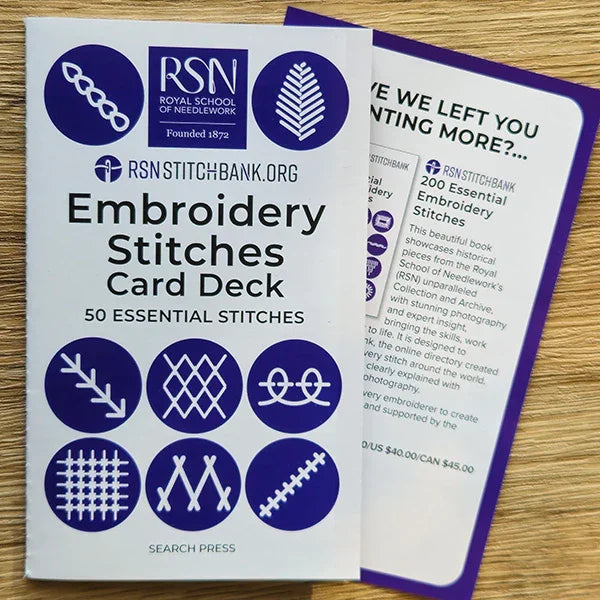Embroidery Stitches Card Deck with Royal School of Needlework branding on a wooden surface