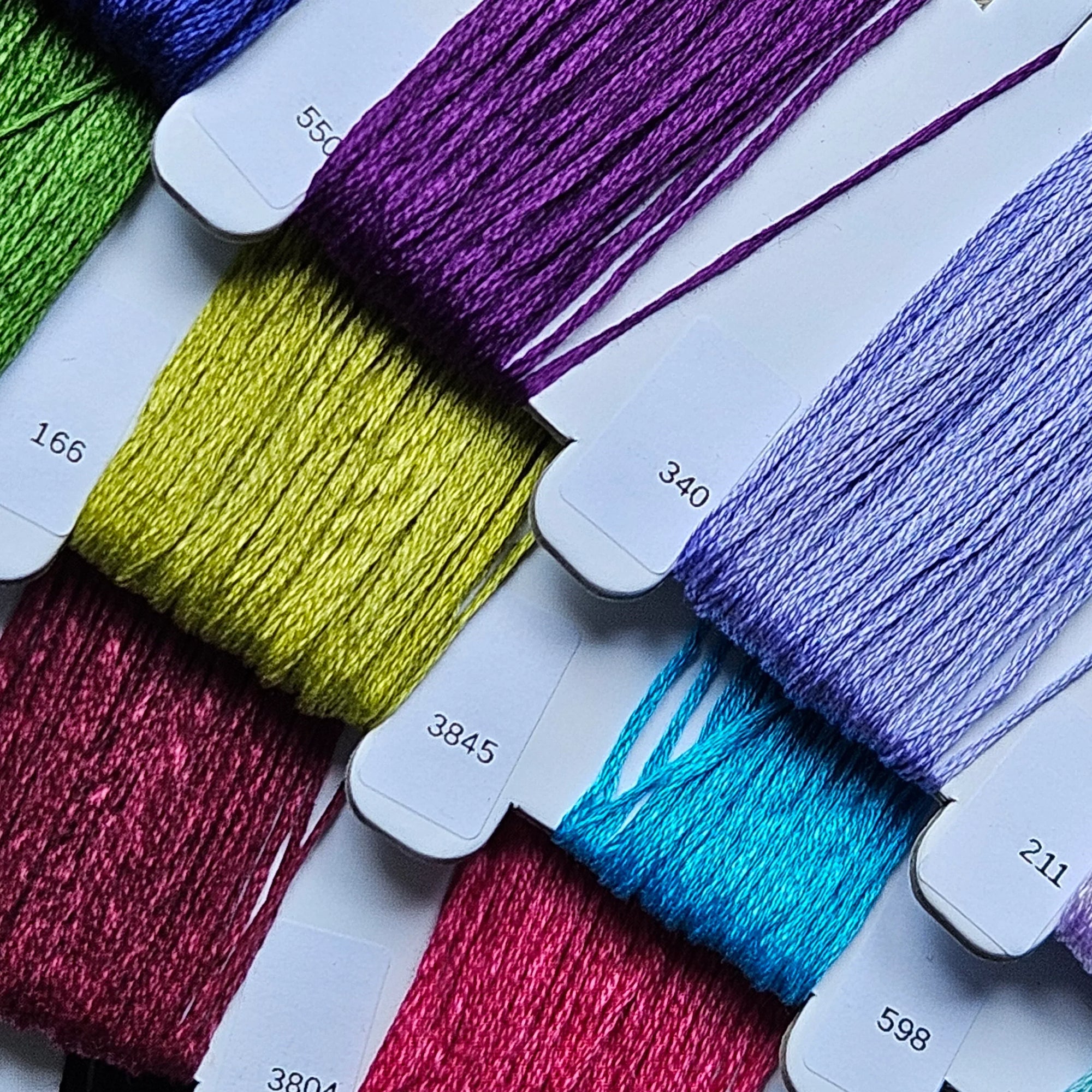 Color swatches with embroidery floss in various colors on a white background