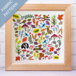 Framed fabric pattern with nature-themed designs on a white background