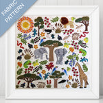 Framed fabric pattern with animals, trees, and plants on a white background