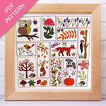 Framed embroidery pattern with nature-themed designs on a white background