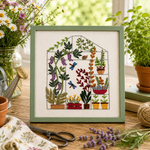 Embroidery of a greenhouse with plants on a wooden table with flowers and plants around.