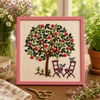 Embroidery of a tree with birds and chairs on a wooden table with plants and a teacup.