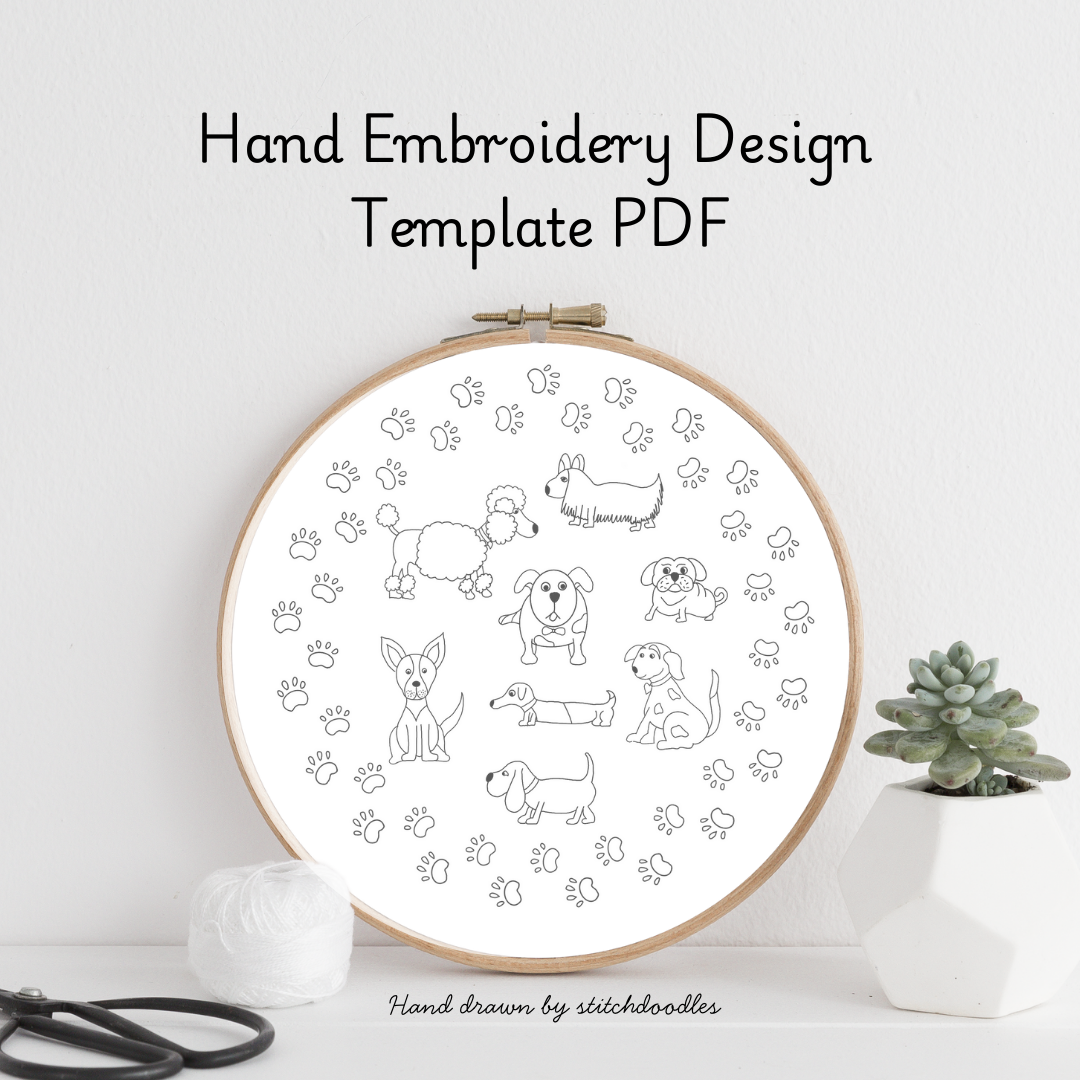 Hand embroidery design template with dogs and paw prints in an embroidery hoop on a white background.