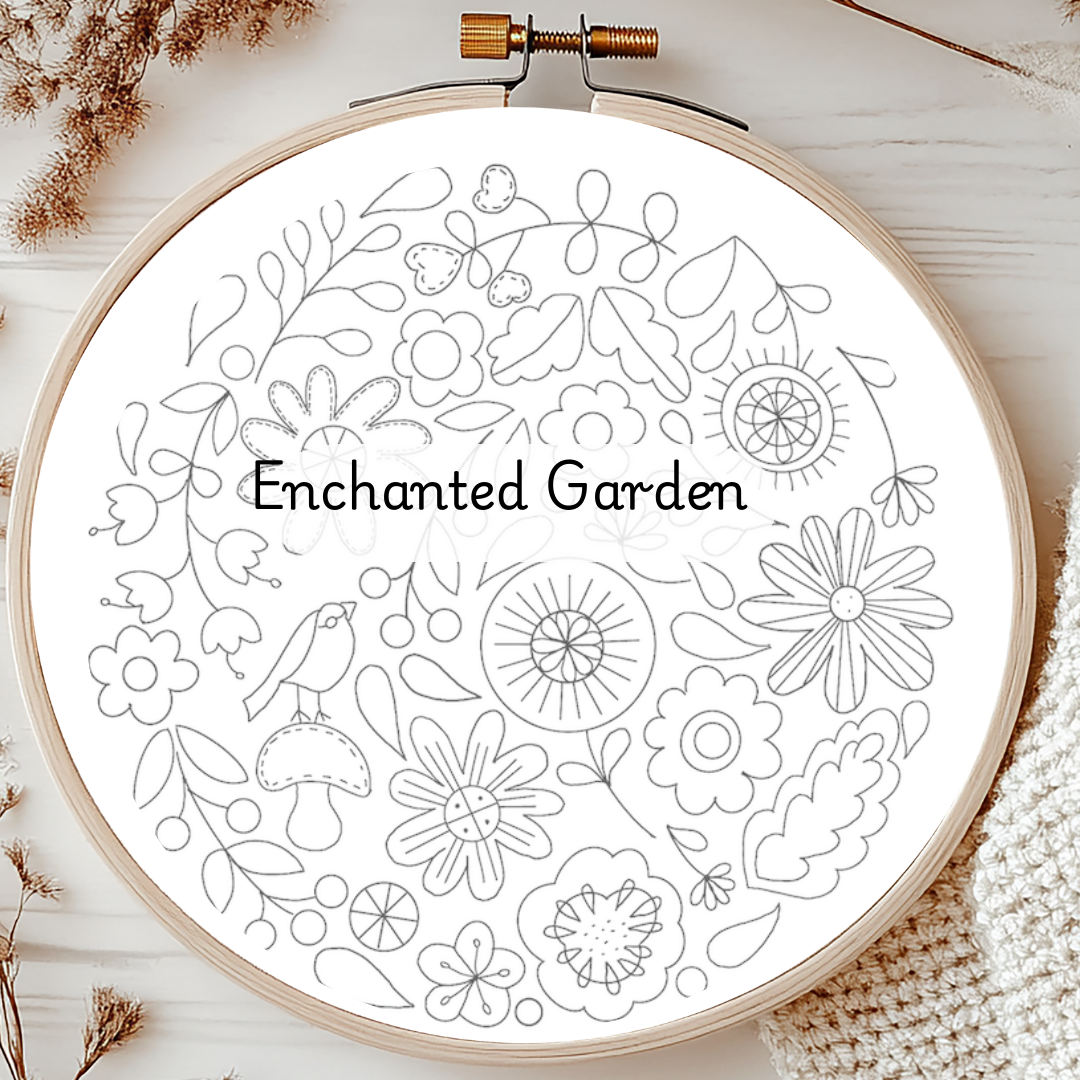 Embroidery hoop with 'Enchanted Garden' floral design on a white background